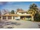 Charming two-story home with a three-car garage and well-maintained front yard at 8970 W Lone Mountain Rd, Las Vegas, NV 89129