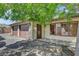 Three-car garage with abundant parking and storage space with an entrance door on the side of the house at 8970 W Lone Mountain Rd, Las Vegas, NV 89129