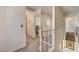 Bright upstairs hallway with carpet and access to bedrooms, offering a calm transition between spaces at 8970 W Lone Mountain Rd, Las Vegas, NV 89129