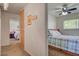 Hallway view into two bedrooms, offering a glimpse of comfortable living spaces with neutral decor at 8970 W Lone Mountain Rd, Las Vegas, NV 89129