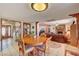 Open concept living room with fireplace and dining area at 8970 W Lone Mountain Rd, Las Vegas, NV 89129
