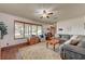 A view of the living room with a large front window providing plenty of natural light at 8970 W Lone Mountain Rd, Las Vegas, NV 89129