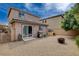 Gravel backyard complete with a doghouse, barbecue, and fire pit at 900 Harbor Ave, Henderson, NV 89002
