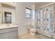 Bright bathroom with a shower and cute shower curtain at 900 Harbor Ave, Henderson, NV 89002