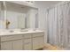 Bathroom features a double sink vanity with large mirror and updated lighting at 900 Harbor Ave, Henderson, NV 89002
