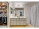 Bright bathroom features a double sink vanity and closet with organized storage at 900 Harbor Ave, Henderson, NV 89002