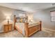 Comfortable primary bedroom with a large bed and natural light at 900 Harbor Ave, Henderson, NV 89002