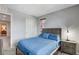 Cozy bedroom featuring neutral tones and a view into the hallway at 900 Harbor Ave, Henderson, NV 89002