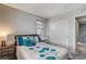 This bedroom includes a window with blinds, a closet, and a vanity at 900 Harbor Ave, Henderson, NV 89002