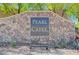 Elegant stone entrance sign for Pearl Creek, set amidst lush landscaping at 900 Harbor Ave, Henderson, NV 89002