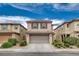 Charming two-story home with tile roof, attached garage, and well-maintained landscaping in a desirable neighborhood at 900 Harbor Ave, Henderson, NV 89002