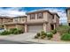 Charming two-story home with tile roof, attached garage, and well-maintained landscaping in a desirable neighborhood at 900 Harbor Ave, Henderson, NV 89002