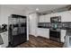 Updated kitchen with black stainless appliances and sleek black countertops at 900 Harbor Ave, Henderson, NV 89002