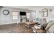 Inviting living room featuring stylish wood floors, neutral paint, comfortable seating, and an open floor plan at 900 Harbor Ave, Henderson, NV 89002