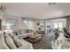 Inviting living room featuring stylish wood floors, neutral paint, comfortable seating, and an open floor plan at 900 Harbor Ave, Henderson, NV 89002