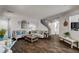 Inviting living room featuring stylish wood floors, neutral paint, comfortable seating, and an open floor plan at 900 Harbor Ave, Henderson, NV 89002