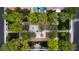 An aerial view showcases a symmetrical park with trees, walkways, and greenery in a residential neighborhood at 9052 Pine Mission Ave, Las Vegas, NV 89143