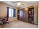 Cozy bedroom featuring a built-in Murphy bed, desk, and ample storage at 9052 Pine Mission Ave, Las Vegas, NV 89143