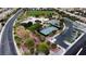 Community park features tennis and basketball courts, playground, and green spaces surrounded by a residential neighborhood at 9052 Pine Mission Ave, Las Vegas, NV 89143