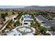 Aerial shot of neighborhood park with basketball, splashpad, parking, and open areas for Gathering activities and enjoyment at 9052 Pine Mission Ave, Las Vegas, NV 89143