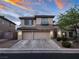 Charming two-story stucco home featuring a spacious driveway and an attached two-car garage at 9052 Pine Mission Ave, Las Vegas, NV 89143