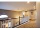 Upstairs hallway with views to the living room, carpeted floors, and recessed lighting at 9052 Pine Mission Ave, Las Vegas, NV 89143
