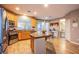 A bright kitchen with stainless appliances and island transitions to the breakfast nook at 9052 Pine Mission Ave, Las Vegas, NV 89143