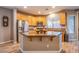 Charming kitchen features stainless appliances and a large island with breakfast bar at 9052 Pine Mission Ave, Las Vegas, NV 89143