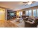 Comfortable living room featuring plantation shutters and a large entertainment center at 9052 Pine Mission Ave, Las Vegas, NV 89143