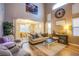 Comfortable living room with soaring ceilings, a neutral color palette, and lots of natural light at 9052 Pine Mission Ave, Las Vegas, NV 89143