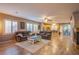 Spacious living area open to kitchen, with wood floors and ample seating at 9052 Pine Mission Ave, Las Vegas, NV 89143