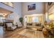 Spacious living room with fireplace, ample seating, and view into the dining area at 9052 Pine Mission Ave, Las Vegas, NV 89143