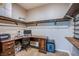 Cozy home office featuring a built-in desk, shelving, and comfortable workspace at 9052 Pine Mission Ave, Las Vegas, NV 89143