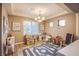 Bright playroom with a ceiling fan, play kitchen, and chalkboard at 9052 Pine Mission Ave, Las Vegas, NV 89143