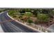 Mountain Ranch neighborhood entrance features a wooden gate, landscaped areas, and well-maintained surroundings at 9052 Pine Mission Ave, Las Vegas, NV 89143