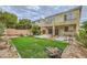 Spacious backyard showing patio and second-story balconies at 10798 Muscari Way, Las Vegas, NV 89141