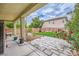 Enclosed backyard with paved patio and small grass area at 10798 Muscari Way, Las Vegas, NV 89141