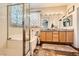 Bright bathroom with a bathtub, shower and dual vanity at 10798 Muscari Way, Las Vegas, NV 89141