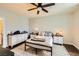 Cozy bedroom featuring a ceiling fan and matching dressers at 10798 Muscari Way, Las Vegas, NV 89141