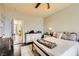 A lovely bedroom with hardwood floors, ceiling fan and a comfy rug at 10798 Muscari Way, Las Vegas, NV 89141