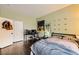 Spacious bedroom with dark wood floors and a closet for storage at 10798 Muscari Way, Las Vegas, NV 89141