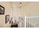 Bright entryway with staircase, decorative lighting, and tiled flooring, offering a welcoming ambiance at 10798 Muscari Way, Las Vegas, NV 89141