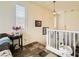 Bright entryway with staircase, decorative lighting, and tiled flooring, offering a welcoming ambiance at 10798 Muscari Way, Las Vegas, NV 89141