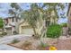Charming two-story home with a two-car garage and low maintenance landscaping, perfect for desert living at 10798 Muscari Way, Las Vegas, NV 89141