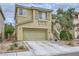 Charming two-story home with a two-car garage and well-maintained landscaping, offering curb appeal at 10798 Muscari Way, Las Vegas, NV 89141