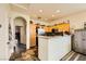 Functional kitchen layout with stainless steel appliances and convenient breakfast bar at 10798 Muscari Way, Las Vegas, NV 89141