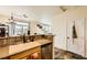 Modern kitchen sink area with stainless steel dishwasher and stone countertop at 10798 Muscari Way, Las Vegas, NV 89141