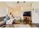 Cozy living room featuring a comfortable sectional, large TV, and slate floors at 10798 Muscari Way, Las Vegas, NV 89141