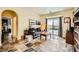 Cozy living room with backyard access, unique tile flooring, and plenty of natural light at 10798 Muscari Way, Las Vegas, NV 89141