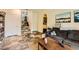 Inviting living room with stone tile flooring, comfortable seating, and tasteful decor at 10798 Muscari Way, Las Vegas, NV 89141
